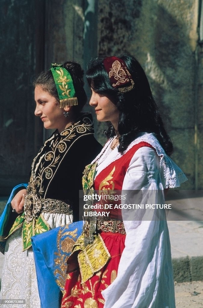 Young women wearing traditional female costume