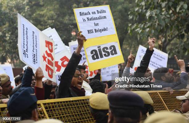 And AISA members shout slogans and protest in front of Maharashtra Sadan against the recent violence against dalits, on January 3, 2018 in New Delhi,...