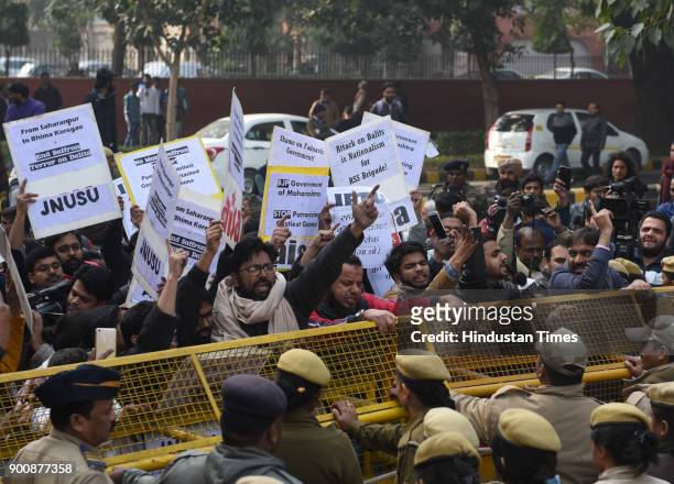 And AISA members shout slogans and protest in front of Maharashtra Sadan against the recent violence against dalits, on January 3, 2018 in New Delhi,...