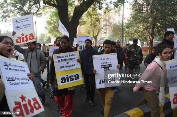 And AISA members shout slogans and protest in front of Maharashtra Sadan against the recent violence against dalits, on January 3, 2018 in New Delhi,...