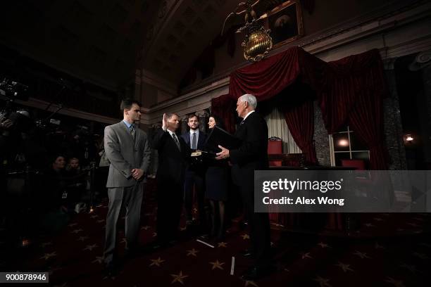 Sen. Doug Jones participates in a mock swearing-in ceremony with Vice President Mike Pence as JonesÕ wife Louise , sons Carson and Christopher look...