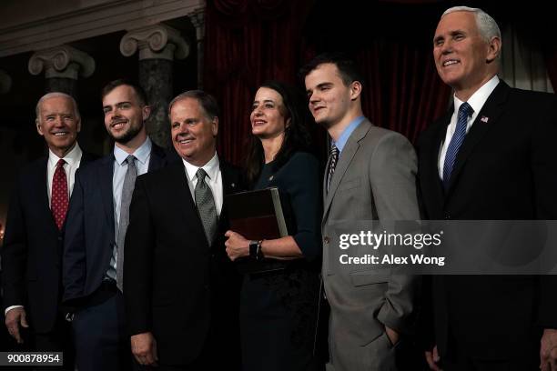 Sen. Doug Jones participates in a group photo with former Vice President Joseph Biden, son Carson, wife Louise, son Christopher and Vice President...