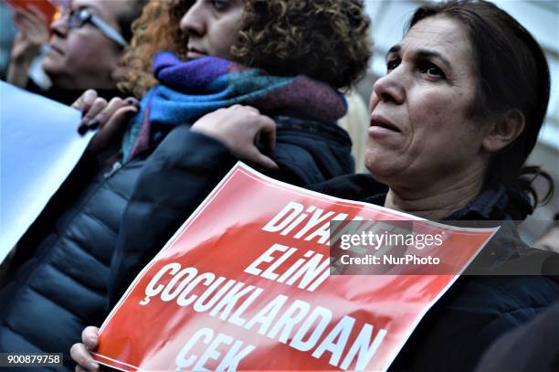 Woman holds a placard as demonstrators gathered to protest against Turkey's Presidency of Religious Affairs in Ankara, Turkey on January 3, 2018. The...