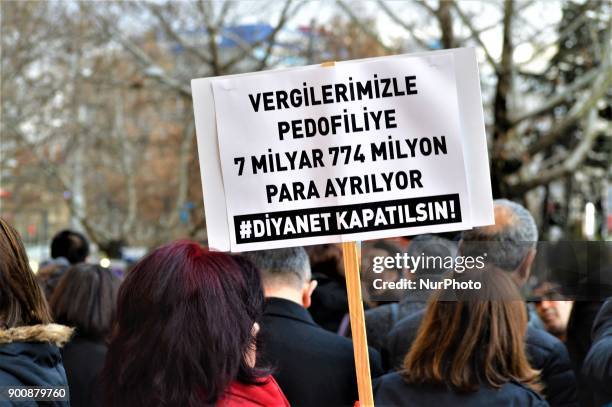 Woman holds a placard as demonstrators gathered to protest against Turkey's Presidency of Religious Affairs in Ankara, Turkey on January 3, 2018. The...