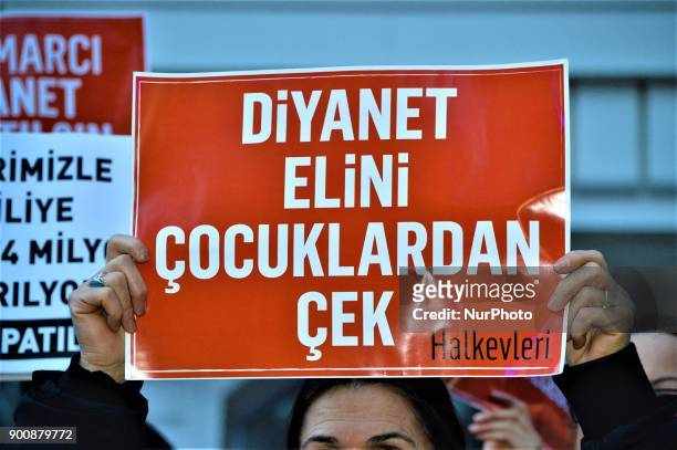 Woman holds up a placard as demonstrators gathered to protest against Turkey's Presidency of Religious Affairs in Ankara, Turkey on January 3, 2018....