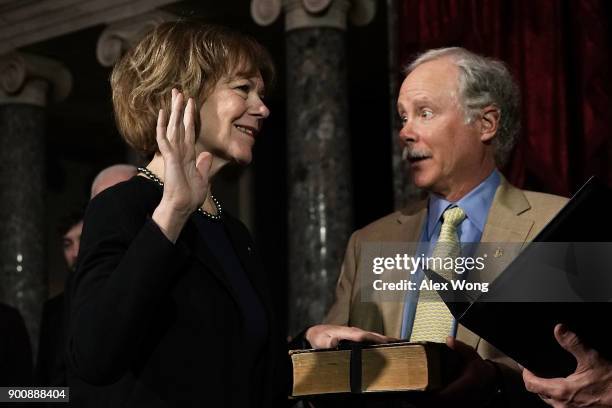 Sen. Tina Smith and her husband Archie Smith participate in a mock swearing-in ceremony at the Old Senate Chamber of the U.S. Capitol January 3, 2018...