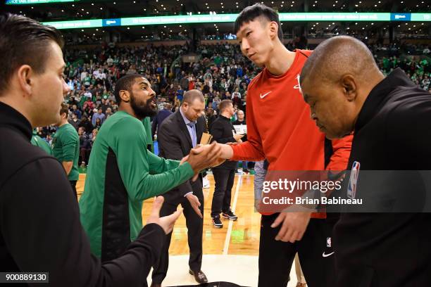 Kyrie Irving of the Boston Celtics and Zhou Qi of the Houston Rockets shake hands before the game on December 28, 2017 at the TD Garden in Boston,...