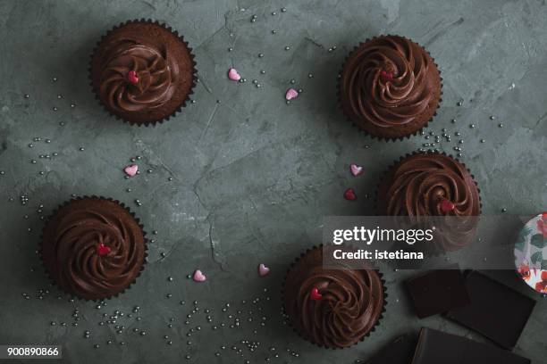 occasions. valentines day chocolate caramel cupcakes - dessert topping stock pictures, royalty-free photos & images