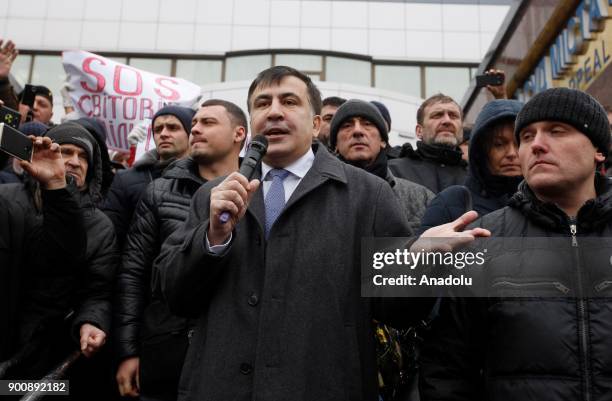 Former Georgian President and ex-governor of the Odessa region of Ukraine Mikheil Saakashvili makes a speech to his supporters after a court hearing...