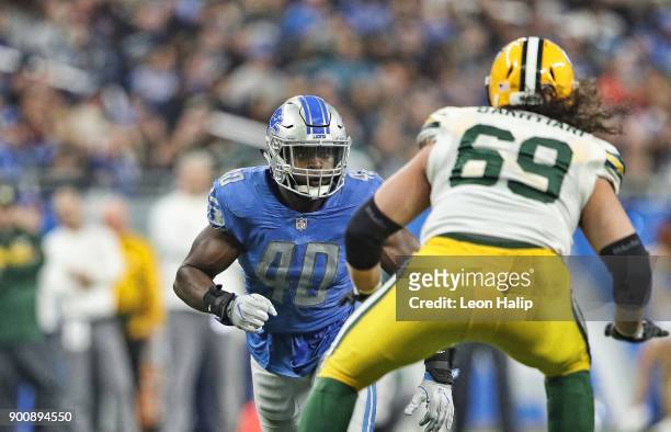 Jarrad Davis of the Detroit Lions checks the quarterback during the fourth quarter of the game against the Green Bay Packers at Ford Field on...