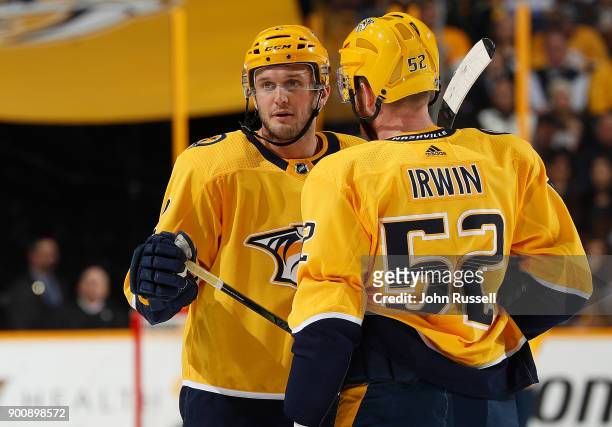 Anthony Bitetto and Matt Irwin of the Nashville Predators after a whistle against the Minnesota Wild during an NHL game at Bridgestone Arena on...