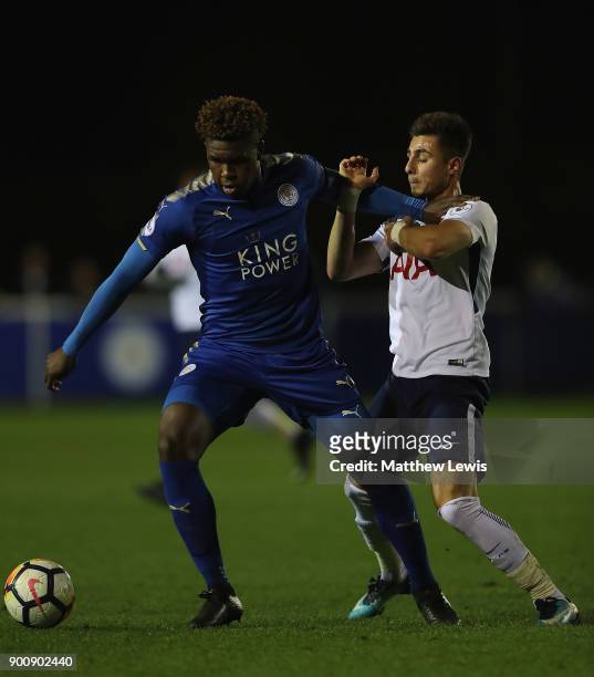 Darnell Johnson of Leicester City and Anthony Georgiou of Spurs challenge for the ball during the Premier League 2 match between Leicester City and...