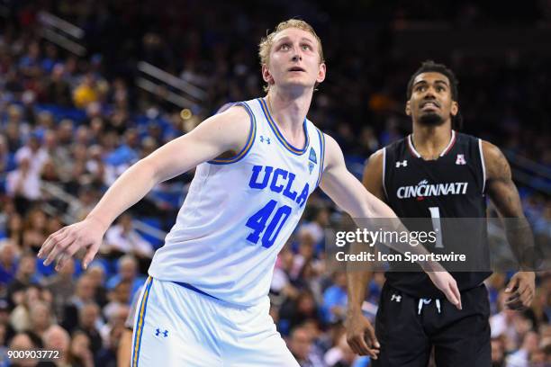 Center Thomas Welsh boxes out Cincinnati guard Jacob Evans during an college basketball game between the Cincinnati Bearcats and the UCLA Bruins on...