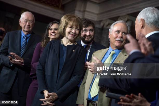 Sen. Tina Smith, D-Minn., is administered an oath by Vice President Mike Pence during a swearing-in ceremony in the Capitol's Old Senate Chamber...