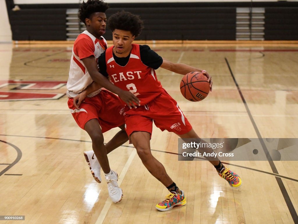 Daylen Kountz, 2, heads down court under pressure from teammate