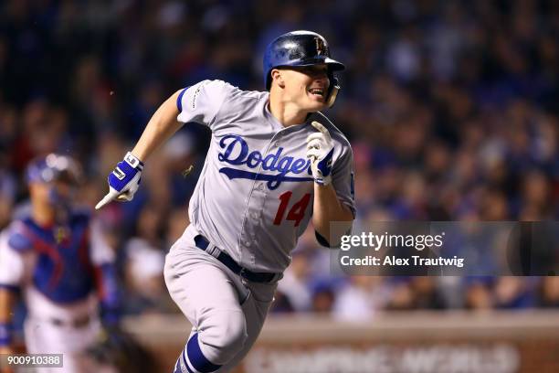 Enrique Hernandez of the Los Angeles Dodgers hits a home run during Game 5 of the National League Championship Series against the Chicago Cubs at...