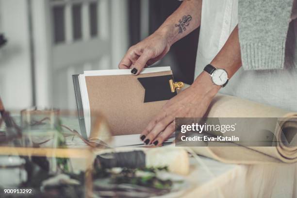 young businesswoman is holding a personal organizer - calendar 2017 stock pictures, royalty-free photos & images