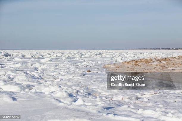 Sea ice covers Cape Cod Bay as viewed from Rock Harbor Beach on January 3, 2018 in Orleans, Massachusetts, A winter storm is hitting the east coast...