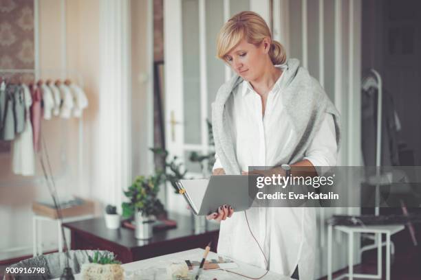 young businesswoman is holding a personal organizer - calendar 2017 stock pictures, royalty-free photos & images