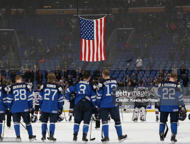 The flag of the United States being raised after the United States beat Finland during the IIHF World Junior Championship at KeyBank Center on...