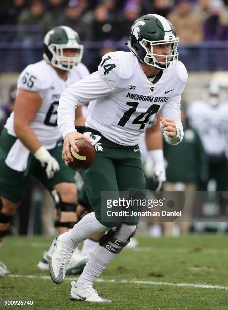Brian Lewerke of the Michigan State Spartans runs against the Northwestern Wildcats at Ryan Field on October 28, 2017 in Evanston, Illinois....