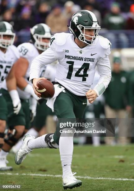 Brian Lewerke of the Michigan State Spartans runs against the Northwestern Wildcats at Ryan Field on October 28, 2017 in Evanston, Illinois....