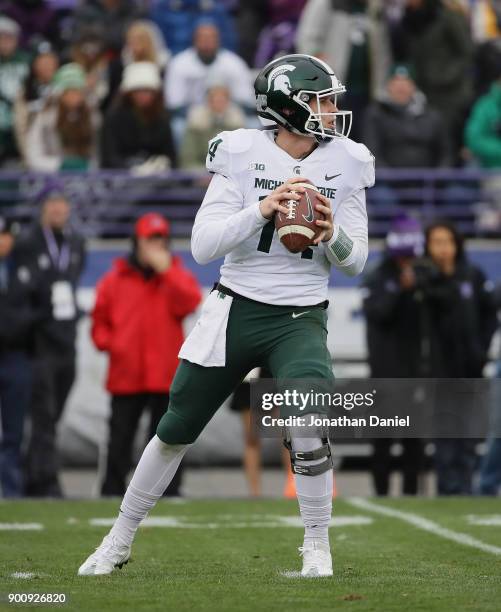 Brian Lewerke of the Michigan State Spartans looks for a receiver against the Northwestern Wildcats at Ryan Field on October 28, 2017 in Evanston,...