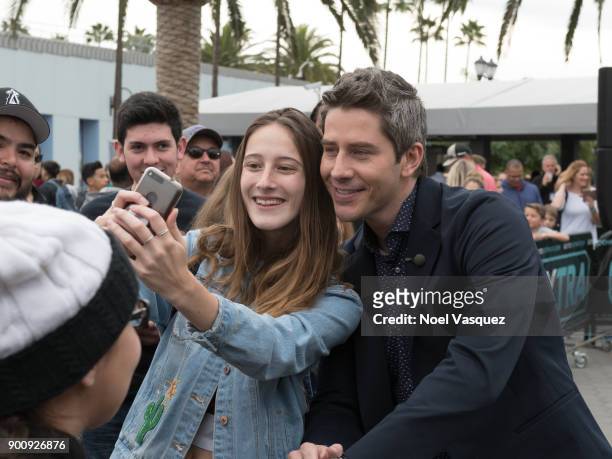 Arie Luyendyk takes a selfie with fans at "Extra" at Universal Studios Hollywood on January 3, 2018 in Universal City, California.