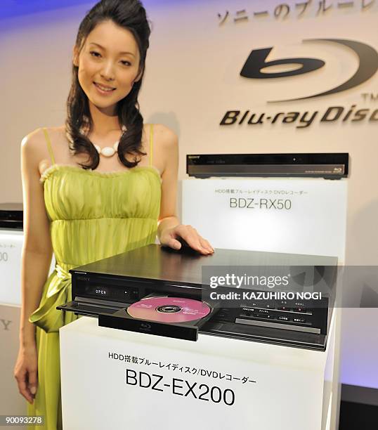 Model shows off Sony's new Blu-Ray disc recorder BDZ-EX200 during a press preview in Tokyo on August 26, 2009. Sony unveiled five Blu-Ray disc...