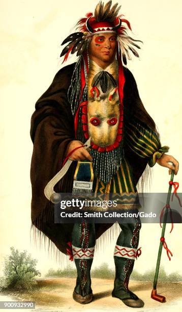 Full length, color illustration of Chippeway Chief Okeemakeequid, wearing red and black face paint, an elaborate beaded and feathered Sioux outfit,...