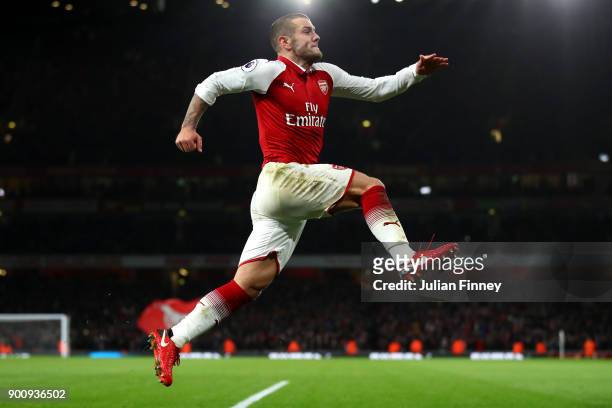 Jack Wilshere of Arsenal celebrates after scoring his sides first goal during the Premier League match between Arsenal and Chelsea at Emirates...