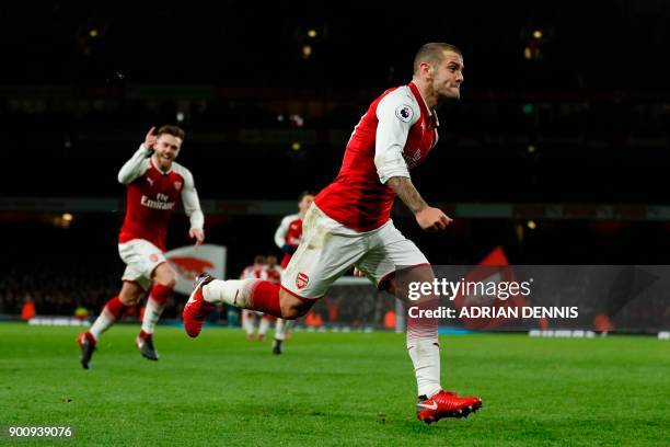 Arsenal's English midfielder Jack Wilshere celebrates after scoring during the English Premier League football match between Arsenal and Chelsea at...