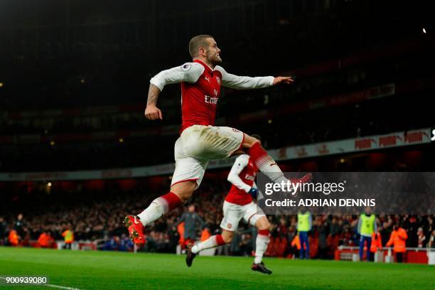 Arsenal's English midfielder Jack Wilshere celebrates after scoring during the English Premier League football match between Arsenal and Chelsea at...