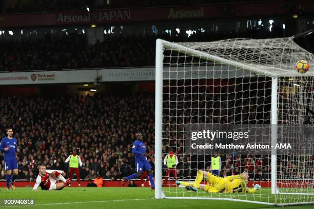 Jack Wilshere of Arsenal scores a goal to make the score 1-0 during the Premier League match between Arsenal and Chelsea at Emirates Stadium on...