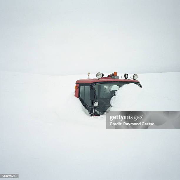 snow tractor buried under snow - langjokull stock pictures, royalty-free photos & images