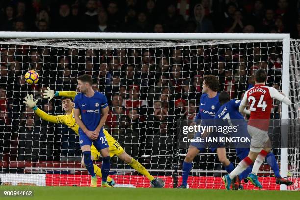 Arsenal's Spanish defender Hector Bellerin shoots and scores past Chelsea's Belgian goalkeeper Thibaut Courtois during the English Premier League...