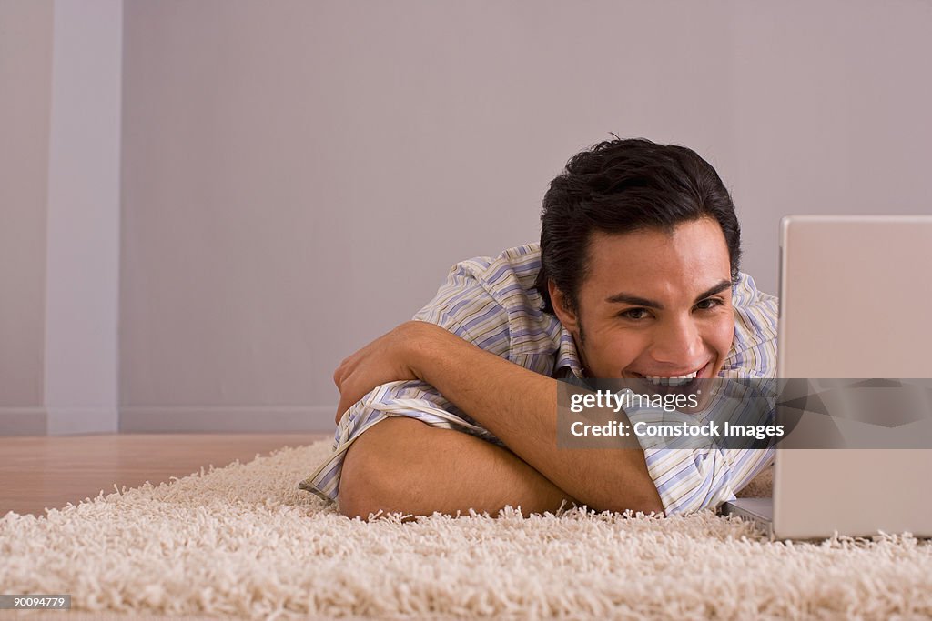 Man on floor with laptop