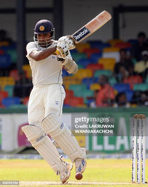 Sri Lankan cricketer Mahela Jayawardene plays a shot during the first day of the second Test match between Sri Lanka and New Zealand at The...