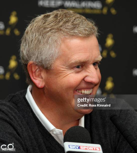 Colin Montgomerie of Scotland talks during his press conference before the pro-am event prior to the Johnnie Walker Championship on the PGA Centenary...