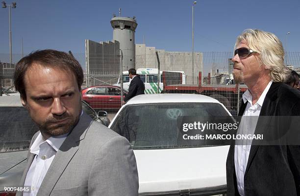 British Richard Branson , chairman of the Virgin Group and one of the founders of �The Elders�, stands near a section of Israel's separation barrier...