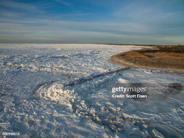 Sea ice covers Cape Cod Bay in the area of Rock Harbor Beach on January 3, 2018 in Orleans, Massachusetts. A winter storm is hitting the east coast...