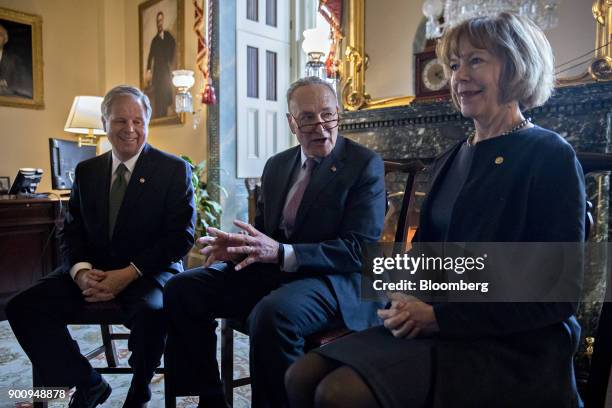 Senate Minority Leader Chuck Schumer, a Democrat from New York, center, speaks with Senator Doug Jones, a Democrat from Alabama, left, and Senator...