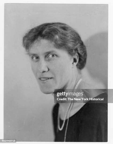 Headshot of Nobel prize-winner Else Brandstrom wearing a dark top and double strand of pearls, 1923.