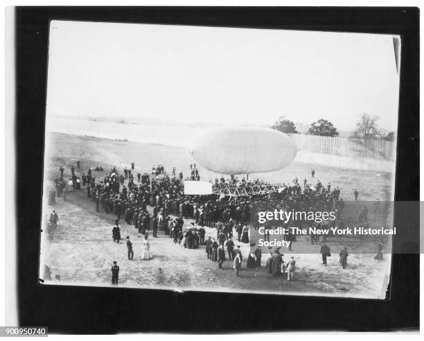 Airship 'California Arrow' resting on sawhorses; surrounded by crowd, Missouri, 1904.