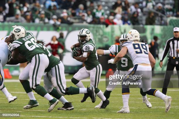 Running Back Bilal Powell of the New York Jets in action against the Los Angeles Chargers in an NFL game at MetLife Stadium on December 24, 2017 in...