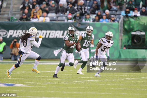 Running Back Bilal Powell of the New York Jets in action against the Los Angeles Chargers in an NFL game at MetLife Stadium on December 24, 2017 in...