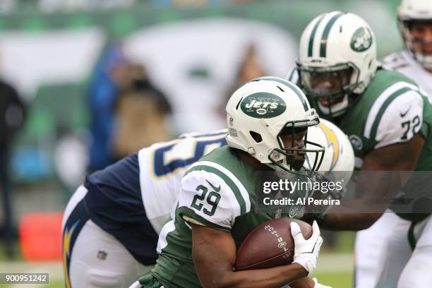 Running Back Bilal Powell of the New York Jets in action against the Los Angeles Chargers in an NFL game at MetLife Stadium on December 24, 2017 in...