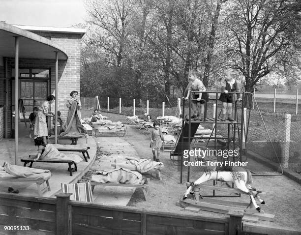 Children take a nap in the playground of the new LCC Woodberry Down Health Centre in London, 15th October 1952. It is the first fully comprehensive...