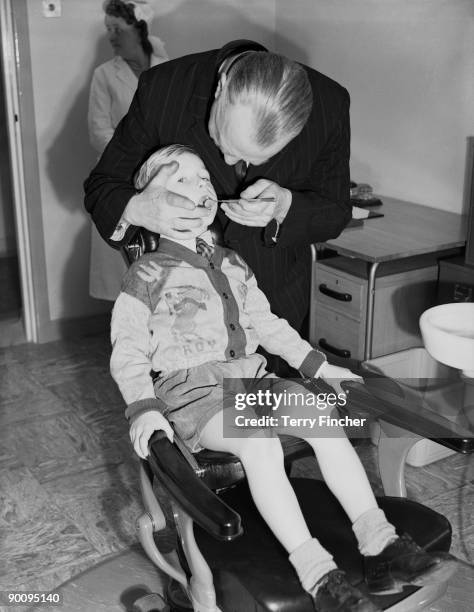 Five-year-old David Hurst is the first child to receive dental treatment at the minor ailments clinic of the new LCC Woodberry Down Health Centre in...