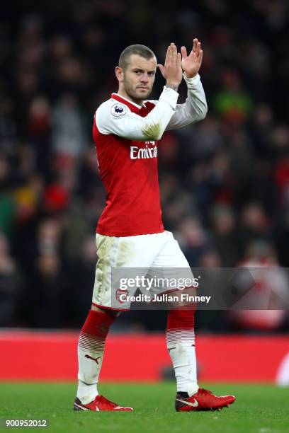 Jack Wilshere of Arsenal shows appreciation to the fans during the Premier League match between Arsenal and Chelsea at Emirates Stadium on January 3,...